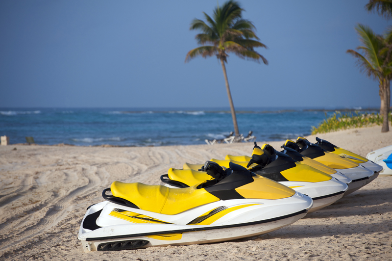 Waverrunners parked on the beach sand waiting to be used